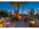 Relaxing patio with fire pit and comfortable seating area at 17409 N Horseshoe Dr, Surprise, AZ 85374