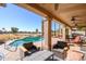 Comfortable patio furniture and seating area overlooking the pool and golf course at 17409 N Horseshoe Dr, Surprise, AZ 85374