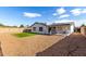 Charming home with a spacious backyard, featuring a grassy area and gravel at 17830 N 30Th St, Phoenix, AZ 85032