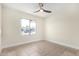 Bright bedroom with tile floors and ceiling fan at 17830 N 30Th St, Phoenix, AZ 85032