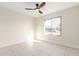 Bright bedroom with tile floors and a ceiling fan at 17830 N 30Th St, Phoenix, AZ 85032