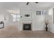 Modern fireplace with a neutral colored mantle and a black insert at 1941 S Pierpont Dr # 2098, Mesa, AZ 85206