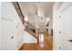 Inviting entryway with staircase and hardwood floors flowing into the living room at 20802 N Grayhawk Dr # 1087, Scottsdale, AZ 85255