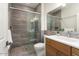 Clean bathroom with walk-in shower and modern vanity at 21609 N 159Th Ln, Sun City West, AZ 85375