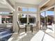 Bright breakfast nook with glass table and access to the backyard at 21609 N 159Th Ln, Sun City West, AZ 85375