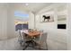 Bright dining room with wood table and window views at 21609 N 159Th Ln, Sun City West, AZ 85375