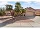 Single-story home with lush landscaping and a welcoming curb appeal at 21609 N 159Th Ln, Sun City West, AZ 85375