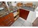 Kitchen island with granite countertop and convenient pull-out drawers at 21609 N 159Th Ln, Sun City West, AZ 85375