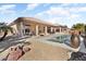 Stunning pool, spa, and expansive patio with fire pit at 21609 N 159Th Ln, Sun City West, AZ 85375