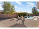 Relaxing pool area with patio furniture and desert landscaping at 21609 N 159Th Ln, Sun City West, AZ 85375