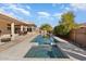 Long rectangular pool with spa and spacious patio at 21609 N 159Th Ln, Sun City West, AZ 85375