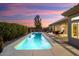 Long rectangular pool with a spa at the end in a backyard setting at 21609 N 159Th Ln, Sun City West, AZ 85375