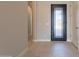 Bright and spacious entryway with modern door at 21951 E Misty Ln, Queen Creek, AZ 85142