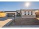 Modern home with gray garage door and brick accents at 21951 E Misty Ln, Queen Creek, AZ 85142