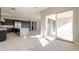 Modern kitchen with island and sliding doors to patio at 21951 E Misty Ln, Queen Creek, AZ 85142