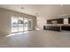 Bright living room with sliding glass doors leading to backyard at 21951 E Misty Ln, Queen Creek, AZ 85142