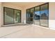 Covered patio with sliding glass doors at 21951 E Misty Ln, Queen Creek, AZ 85142