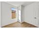 Well-lit bedroom featuring wood-look tile flooring at 31381 N 130Th Ave, Peoria, AZ 85383