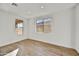 Bright bedroom with wood-look tile flooring and dual windows at 31381 N 130Th Ave, Peoria, AZ 85383