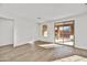 Bright living room with sliding glass door leading to a backyard patio at 31381 N 130Th Ave, Peoria, AZ 85383