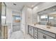 Double vanity bathroom with marble and grey cabinets at 33333 N 132Nd Dr, Peoria, AZ 85383