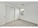 Well-lit bedroom featuring carpet and double doors at 33333 N 132Nd Dr, Peoria, AZ 85383