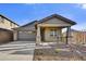 New single-story home with stone accents and a two-car garage at 33333 N 132Nd Dr, Peoria, AZ 85383