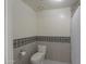 Clean bathroom with toilet and patterned tile at 4053 E Glencove St, Mesa, AZ 85205