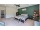 Spacious bedroom with king bed and built-in shelving at 4053 E Glencove St, Mesa, AZ 85205