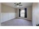 Bright bedroom with ceiling fan and carpet flooring at 4053 E Glencove St, Mesa, AZ 85205