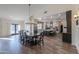 Elegant dining room adjacent to kitchen, hardwood floors at 4053 E Glencove St, Mesa, AZ 85205