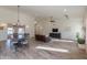 Open concept dining room with hardwood floors and chandelier at 4053 E Glencove St, Mesa, AZ 85205