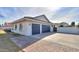 Two-car garage with dark-colored doors and arched windows at 4053 E Glencove St, Mesa, AZ 85205