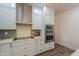 White kitchen with stainless steel appliances and backsplash at 4053 E Glencove St, Mesa, AZ 85205