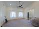 Bright bedroom with a ceiling fan and neutral carpeting at 4053 E Glencove St, Mesa, AZ 85205