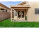 Covered patio with double doors leading to a grassy backyard at 41 E Caroline Ln, Tempe, AZ 85284