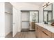 Bathroom with double vanity and mirrored closet at 41 E Caroline Ln, Tempe, AZ 85284