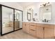 Modern bathroom with double vanity and a large mirror at 41 E Caroline Ln, Tempe, AZ 85284