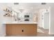 Modern kitchen with white cabinets, wood island and quartz countertops at 41 E Caroline Ln, Tempe, AZ 85284