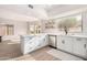 Modern kitchen with white cabinets, stainless steel appliances, and island at 41 E Caroline Ln, Tempe, AZ 85284