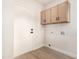 Laundry room with upper cabinets and vinyl flooring at 41 E Caroline Ln, Tempe, AZ 85284