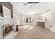 Living room with fireplace, wood floors and kitchen view at 41 E Caroline Ln, Tempe, AZ 85284