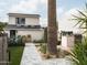 Landscaped backyard with herringbone path and outdoor kitchen at 61 W Wilshire Dr, Phoenix, AZ 85003