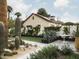 Expansive backyard with lush landscaping and a view of the house at 61 W Wilshire Dr, Phoenix, AZ 85003