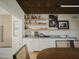 Modern bar with marble countertop, wine cooler, and stylish shelving at 61 W Wilshire Dr, Phoenix, AZ 85003