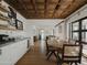 Bright dining room with hardwood floors and built-in shelving at 61 W Wilshire Dr, Phoenix, AZ 85003