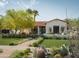 Charming Spanish-style home with landscaped front yard at 61 W Wilshire Dr, Phoenix, AZ 85003