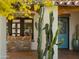 Charming front porch with rustic bench and cacti at 61 W Wilshire Dr, Phoenix, AZ 85003