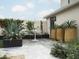 Charming patio with white table and large potted plants at 61 W Wilshire Dr, Phoenix, AZ 85003