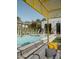 Relaxing pool area with yellow pergola and comfy seating at 61 W Wilshire Dr, Phoenix, AZ 85003